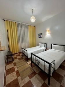 Postel nebo postele na pokoji v ubytování Hotel Al Manar