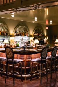 a bar with four chairs and a counter at RT Lodge in Maryville