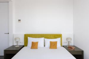 Posteľ alebo postele v izbe v ubytovaní Cosmo Apartments Sants