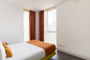 Posteľ alebo postele v izbe v ubytovaní Cosmo Apartments Sants