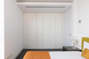 Posteľ alebo postele v izbe v ubytovaní Cosmo Apartments Sants