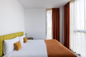 Posteľ alebo postele v izbe v ubytovaní Cosmo Apartments Sants
