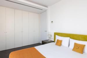 Posteľ alebo postele v izbe v ubytovaní Cosmo Apartments Sants