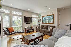 a living room with a couch and a table at Luxury 5-Bedroom Home in LoHi in Denver