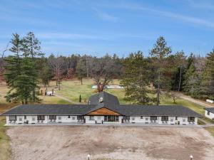 an aerial view of a large white house at The Windmoor Lodge in Grayling