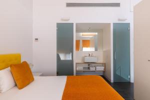 Posteľ alebo postele v izbe v ubytovaní Cosmo Apartments Sants