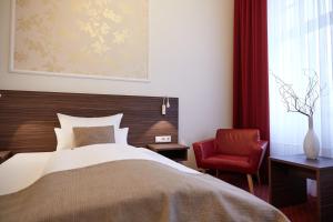 Postel nebo postele na pokoji v ubytování Hotel Prinzregent