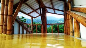 a room with a view of the mountains at Hospedaje piedras de agua in Santa Marta