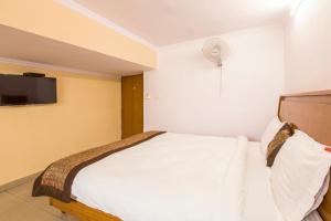 TV a/nebo společenská místnost v ubytování Hotel O Hotel Landmark Inn