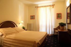 Postel nebo postele na pokoji v ubytování Hotel Residence Valverde