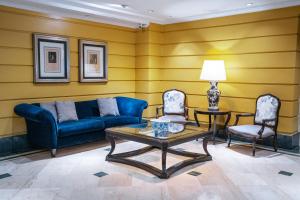 Uma área de estar em Amérian Executive Mendoza Hotel