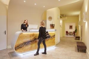 Postel nebo postele na pokoji v ubytování Hotel Prinzregent
