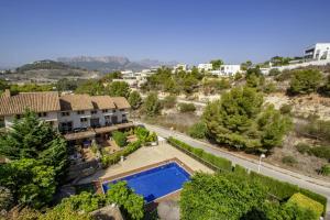 an aerial view of a house with a swimming pool at Alegre Playa Grupo Terra De Mar in Calpe