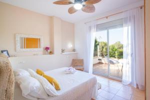 a bedroom with a bed and a sliding glass door at Alegre Playa Grupo Terra De Mar in Calpe +33 photos