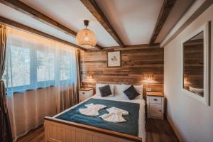 Postel nebo postele na pokoji v ubytování Breza Hotel Borovets