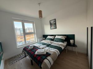 Ένα ή περισσότερα κρεβάτια σε δωμάτιο στο Apartament Business & Family