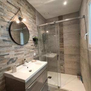 a bathroom with a sink and a shower at la chambre de Valérie in Saint-Bonnet-de-Mure +6 photos