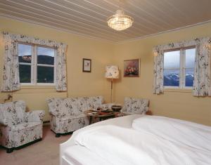 Postel nebo postele na pokoji v ubytování Fossli Hotel