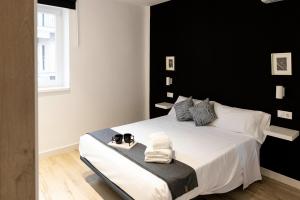 Cama o camas de una habitación en Apartamentos Julio Burell, 74