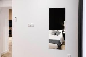 Cama o camas de una habitación en Apartamentos Julio Burell, 74