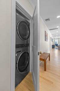 a hallway with two washer and dryers in a room at Family Friendly 3BD Oasis-Parking, WIFI & Pets OK! in Salem