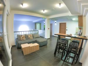 a living room with a couch and a table at Boulevard Luxury Apartments City Center Ohrid in Ohrid
