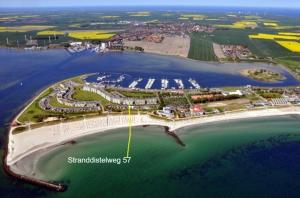 an aerial view of a beach with a harbor at FW Knütel Nr 57 in Burgtiefe auf Fehmarn  +8 photos