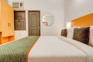 Postel nebo postele na pokoji v ubytování Hotel O Star Key