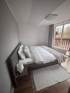 Posteľ alebo postele v izbe v ubytovaní Apartmán 11 Nová Lesná