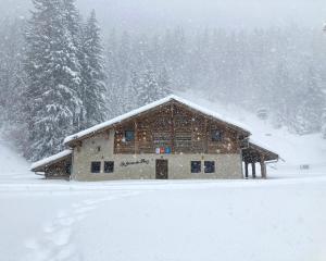 a log cabin in the snow with snow at La Ferme du Praz in Les Contamines-Montjoie +20 photos
