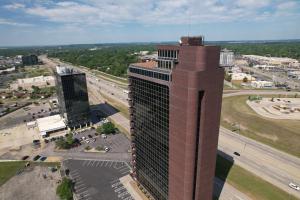 an aerial view of a tall building in a city at 1 - Serenity Suite - 1 - Reese Tower in Tulsa