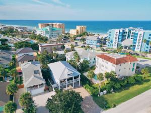 an aerial view of a city with buildings and the ocean at LaLa`s Beachside Getaway! 5 BR, Hammocks, Beach! in New Smyrna Beach