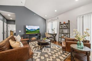 a living room with a couch and a tv at Hudgens Court Getaway in Cookeville