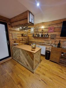 a kitchen with wooden walls and a wooden counter top at Cedar Lodge in Bowness-on-Windermere