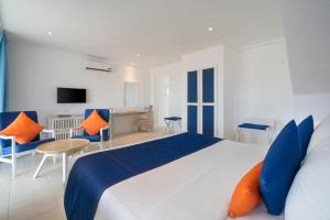 Ένα ή περισσότερα κρεβάτια σε δωμάτιο στο Trinco Blu by Cinnamon +33 φωτογραφίες