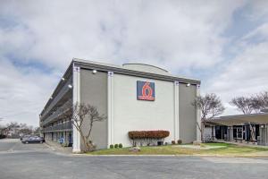 a front view of a building with a cvs pharmacy at Studio 6 Mesquite, TX Town East in Mesquite