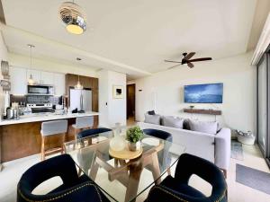 a living room with a couch and a table and chairs at Rosarito Misión Viejo Sur in La Bloquera +26 photos