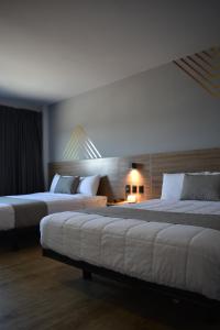 Katil atau katil-katil dalam bilik di Avanta Hotel & Villas Querétaro