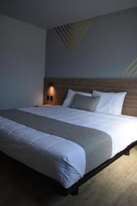 Katil atau katil-katil dalam bilik di Avanta Hotel & Villas Querétaro