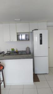 Η κουζίνα ή μικρή κουζίνα στο Apartamento Porto Real Suites