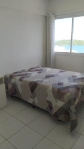 Ένα ή περισσότερα κρεβάτια σε δωμάτιο στο Apartamento Porto Real Suites +35 φωτογραφίες