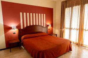 Postel nebo postele na pokoji v ubytování Hotel mariuccia