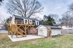 a house with a deck and a house at 6 Mi to Spectrum Center: Spacious Getaway w/ Deck in Charlotte