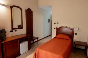Postel nebo postele na pokoji v ubytování Hotel mariuccia