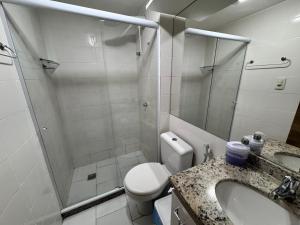 a bathroom with a shower and a toilet and a sink at Lapa reformado melhor localização in Rio de Janeiro