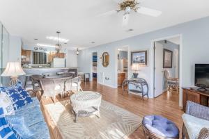 a living room with a couch and a table at Bayview 55 by Vacation Homes Collection in Orange Beach