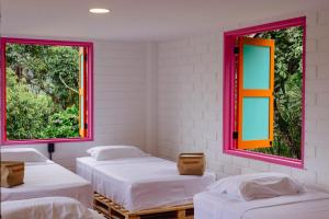 Postel nebo postele na pokoji v ubytování Isla de pascua - Jardín - Hostel