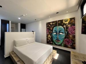 Postel nebo postele na pokoji v ubytování Graffity Hotel Med