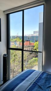 Postel nebo postele na pokoji v ubytování Habitación privada en departamento compartido centro de la cuidad de México CDMX Buenavista, cerca de reforma revolución zocalo