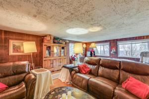 a living room with a couch and a table at Rustic Chic Retreat 4 Mi to Kennywood! in West Mifflin